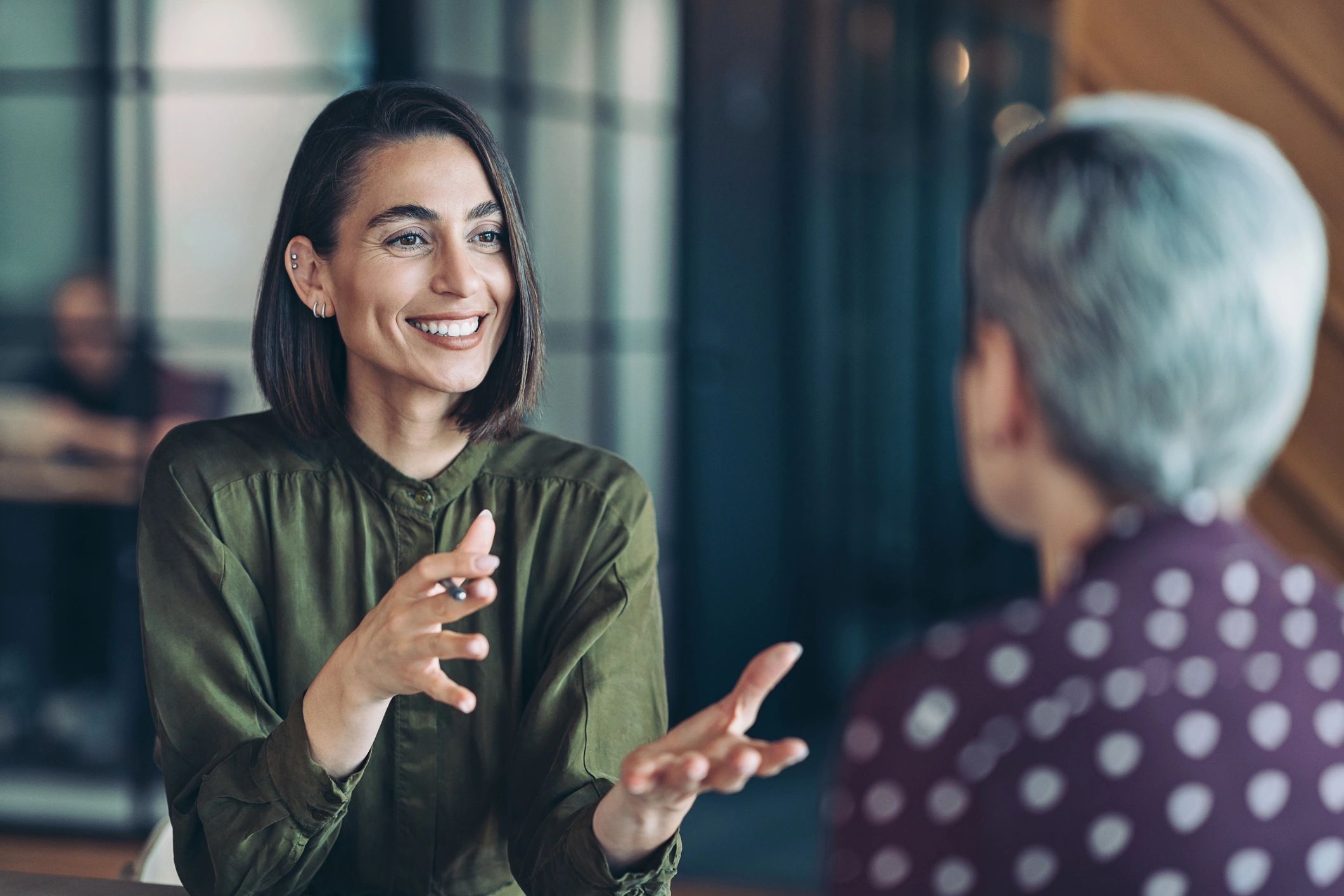 Two women talking together in a supportive setting